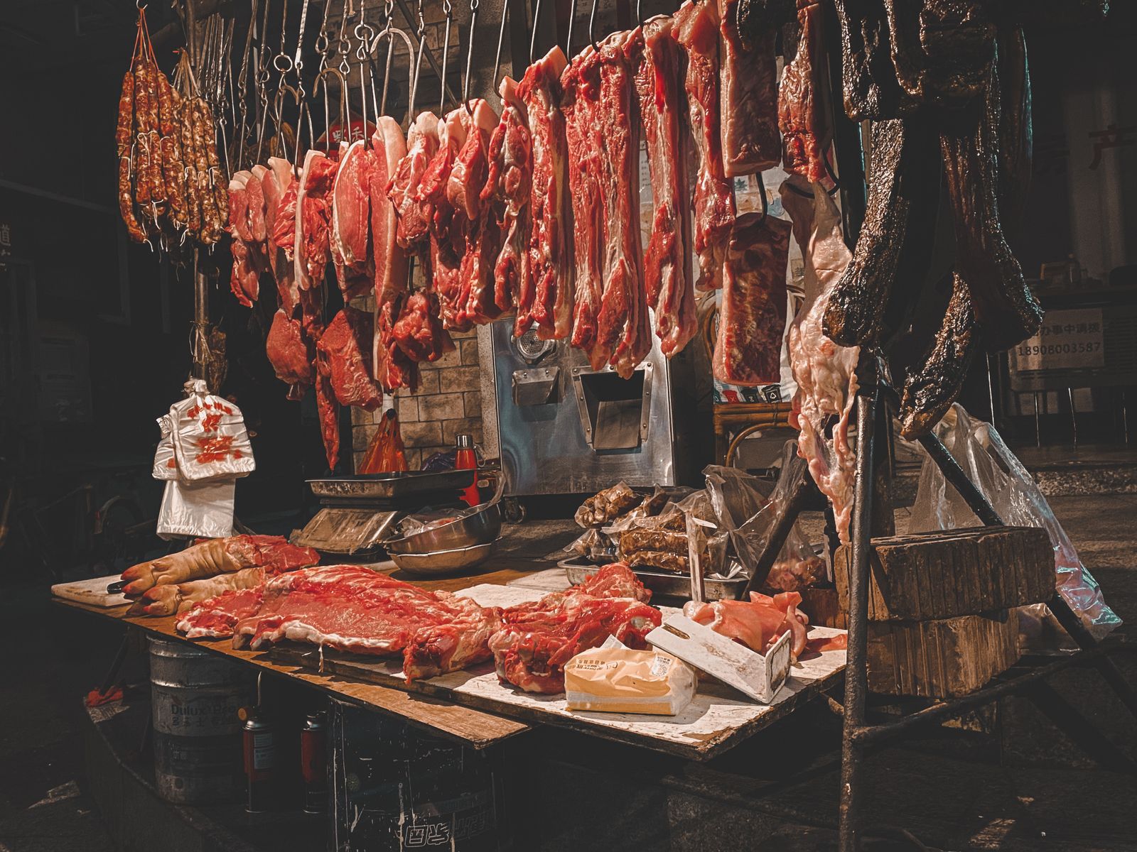 Hanging cured meats in an old-world butcher's stall